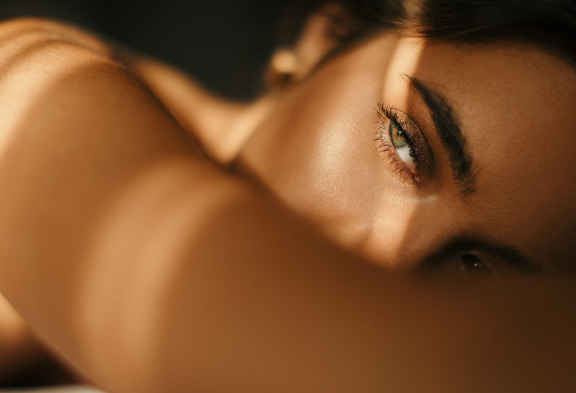 Woman laying down with light shining on her face