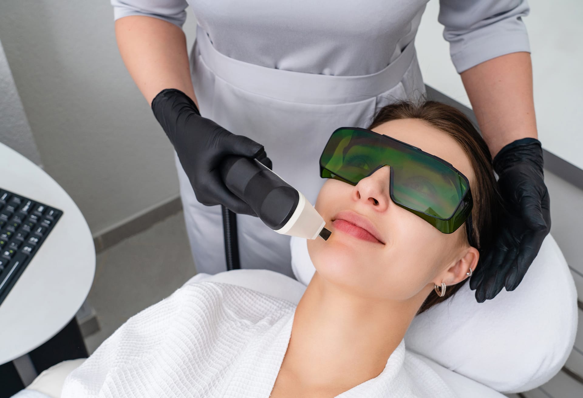 Woman undergoing facial treatment