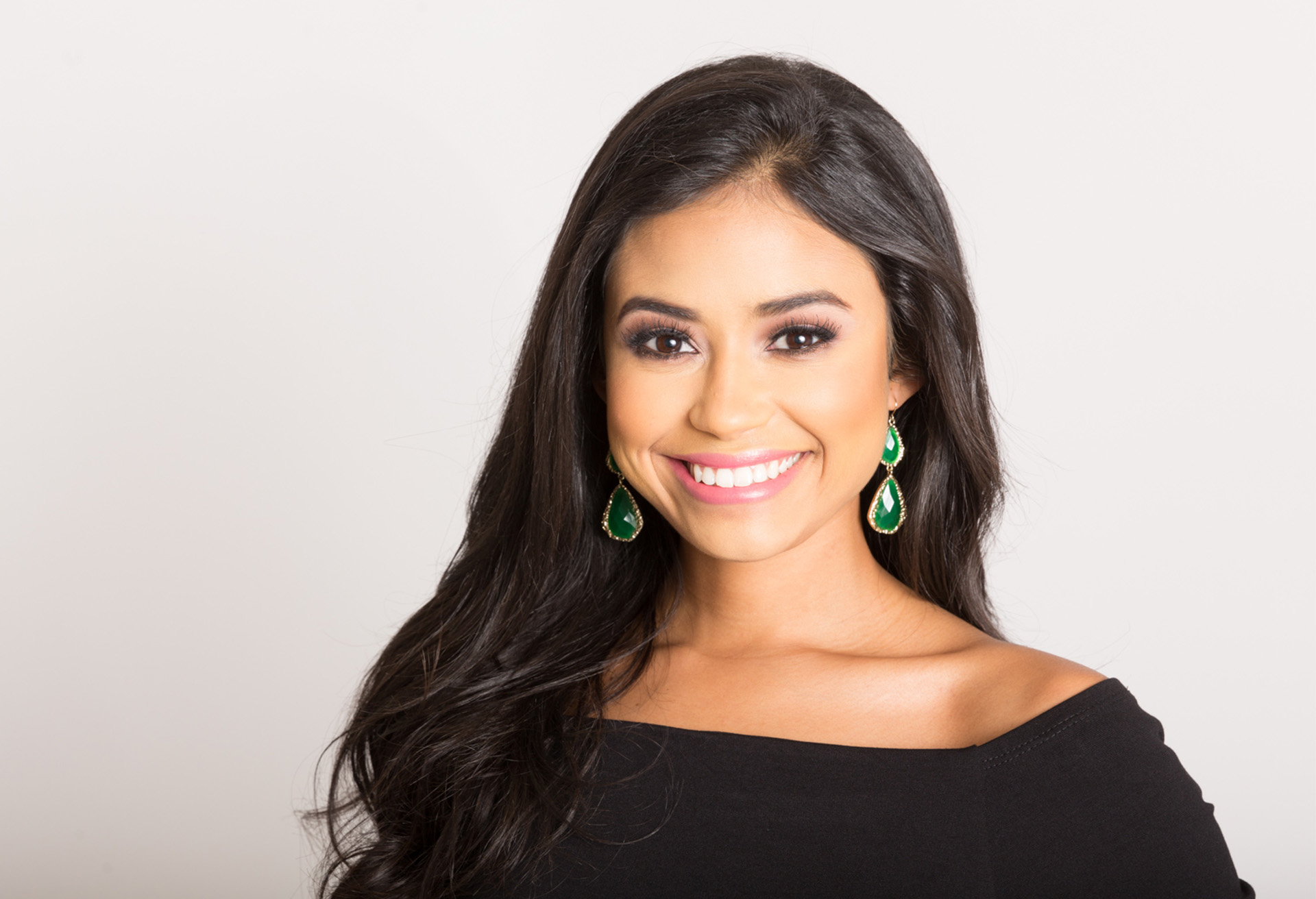 Woman in a black shirt smiling