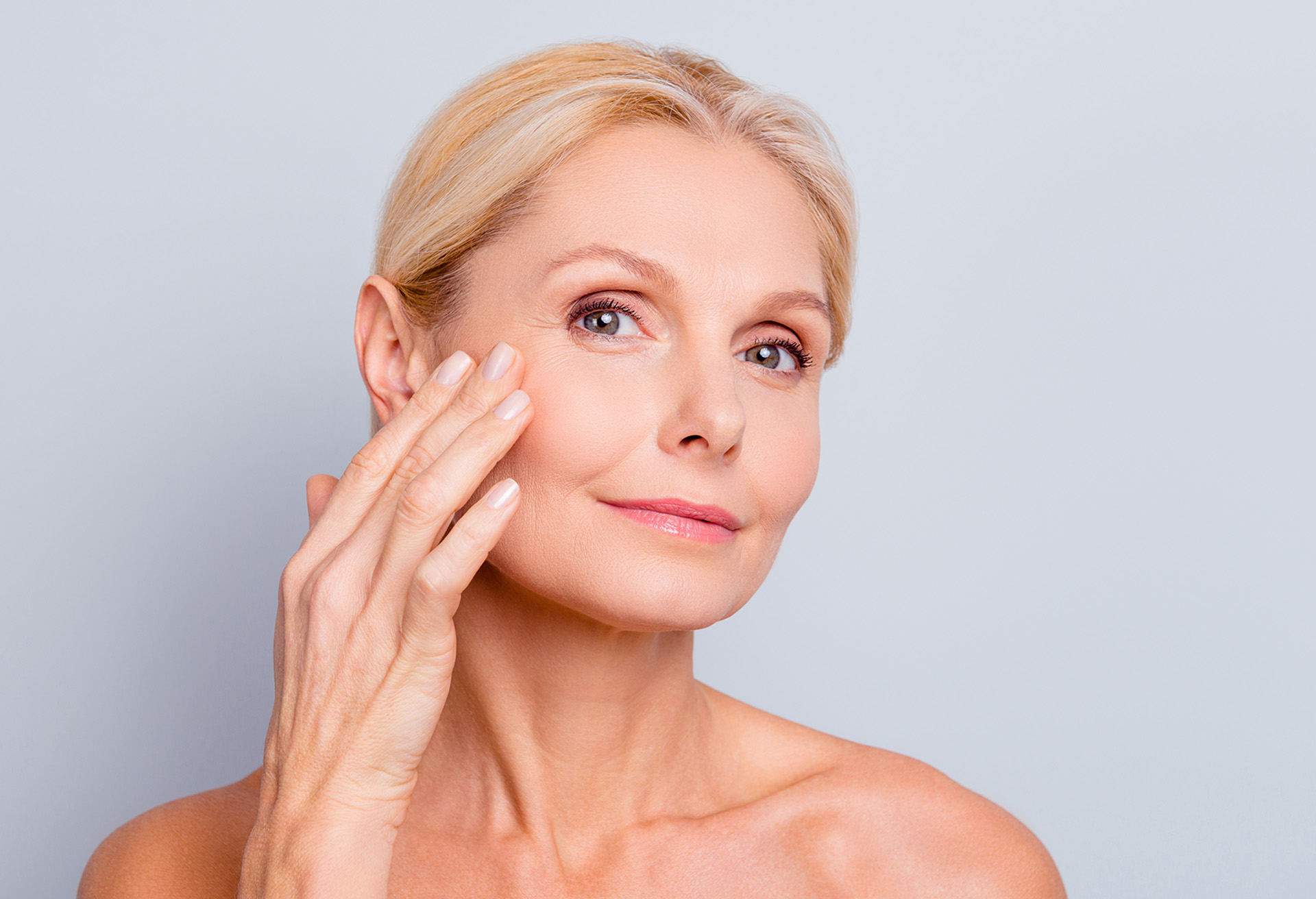 Woman posing with her hand on her face