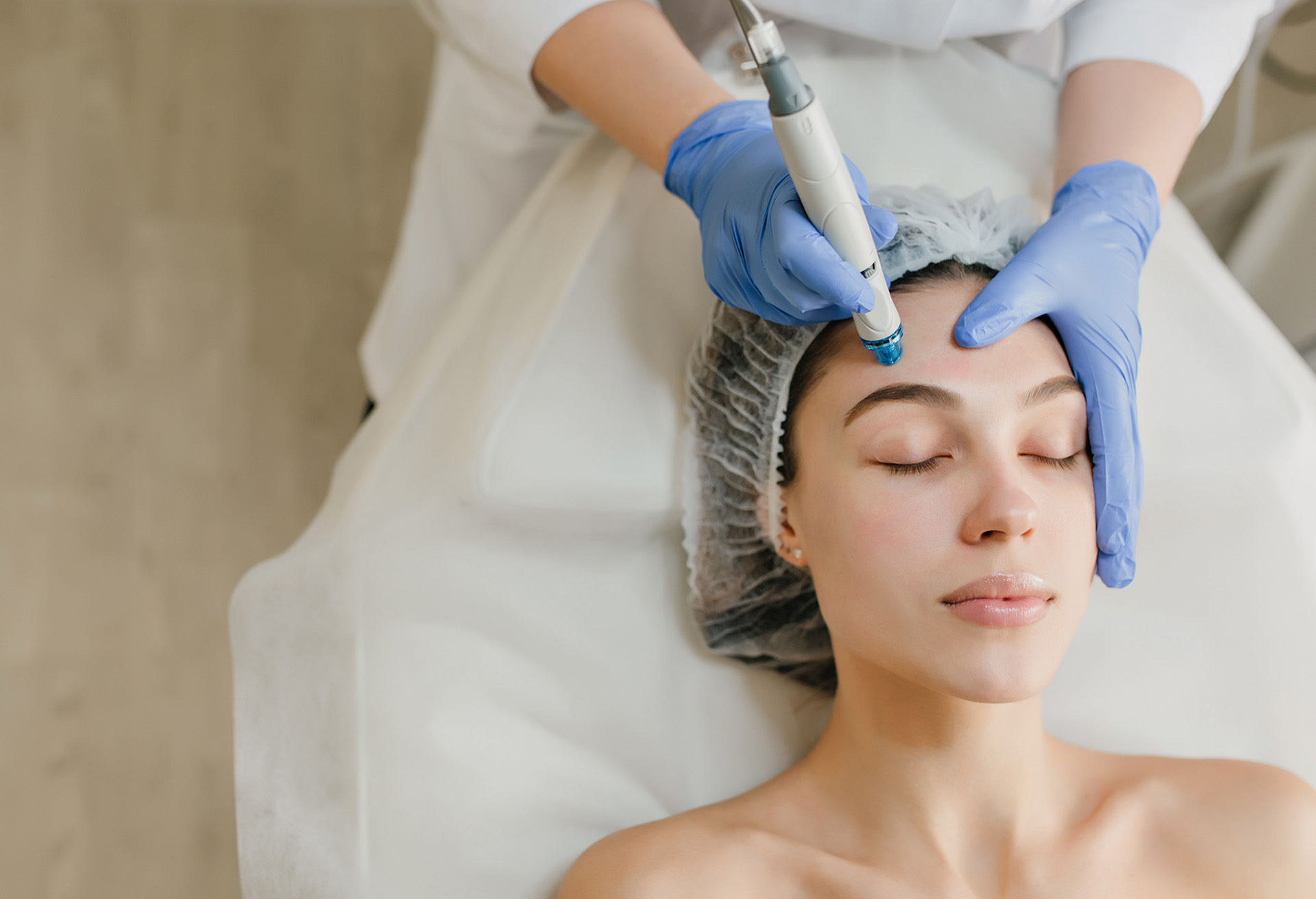 Woman getting facial treatment