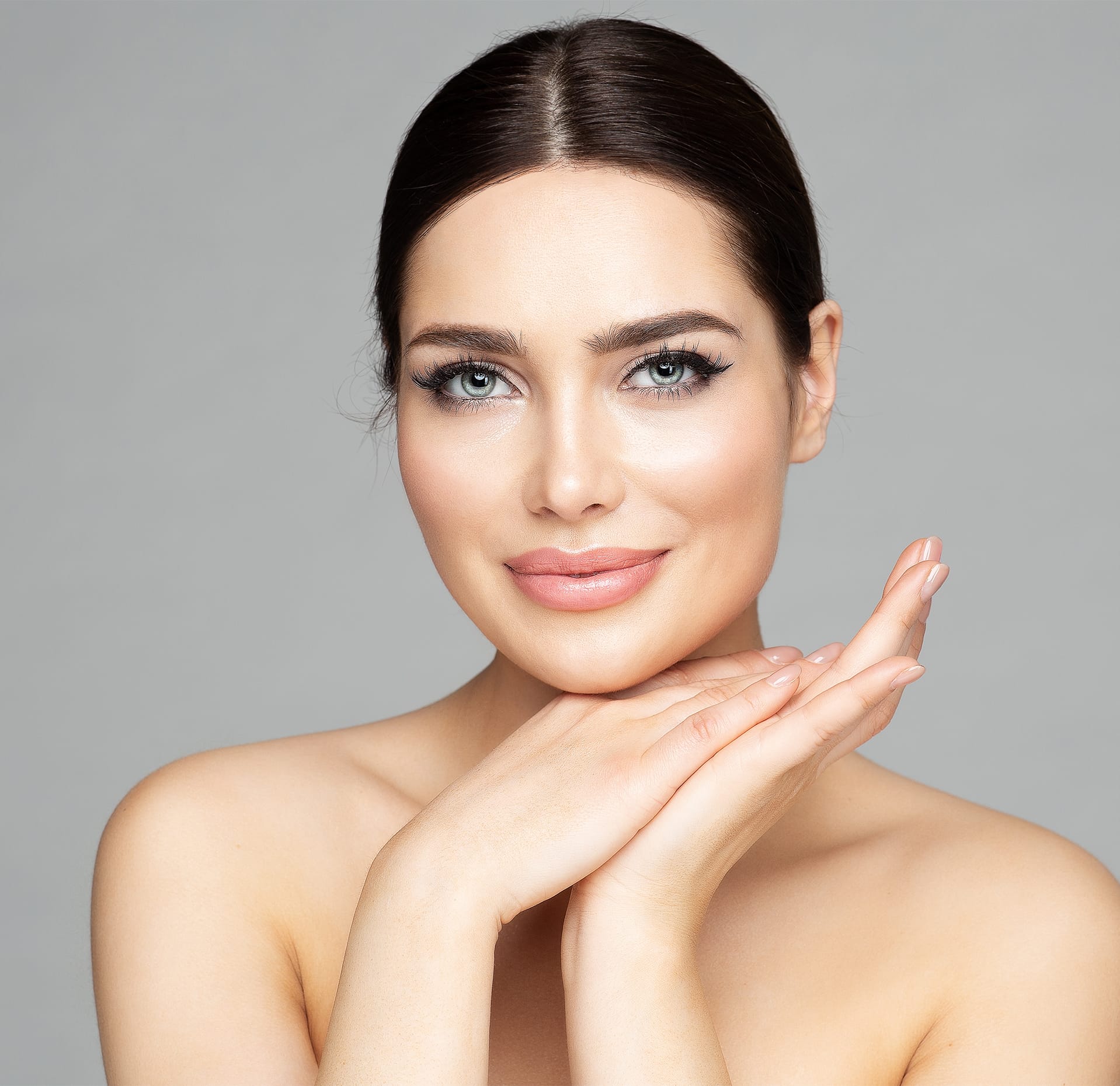 Woman posing with her chin on her hands