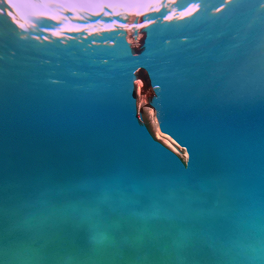 Woman swimming in the ocean